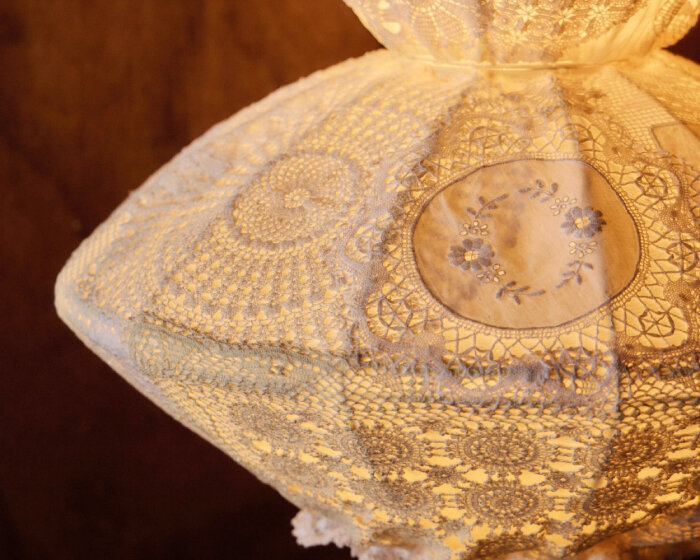 light sculptures preserve ancestral designs through antique doilies and lace textiles