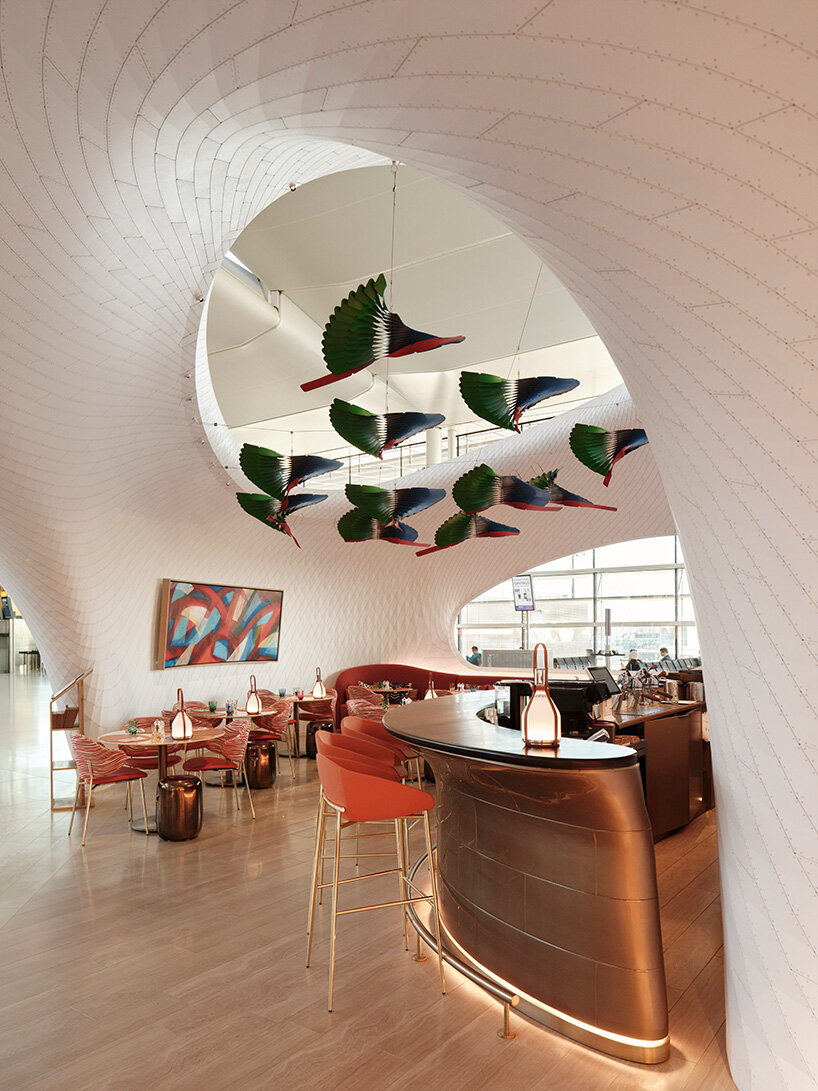 marc fornes / THEVERYMANY lands fuselage-like louis vuitton caf&eacute; and store at heathrow