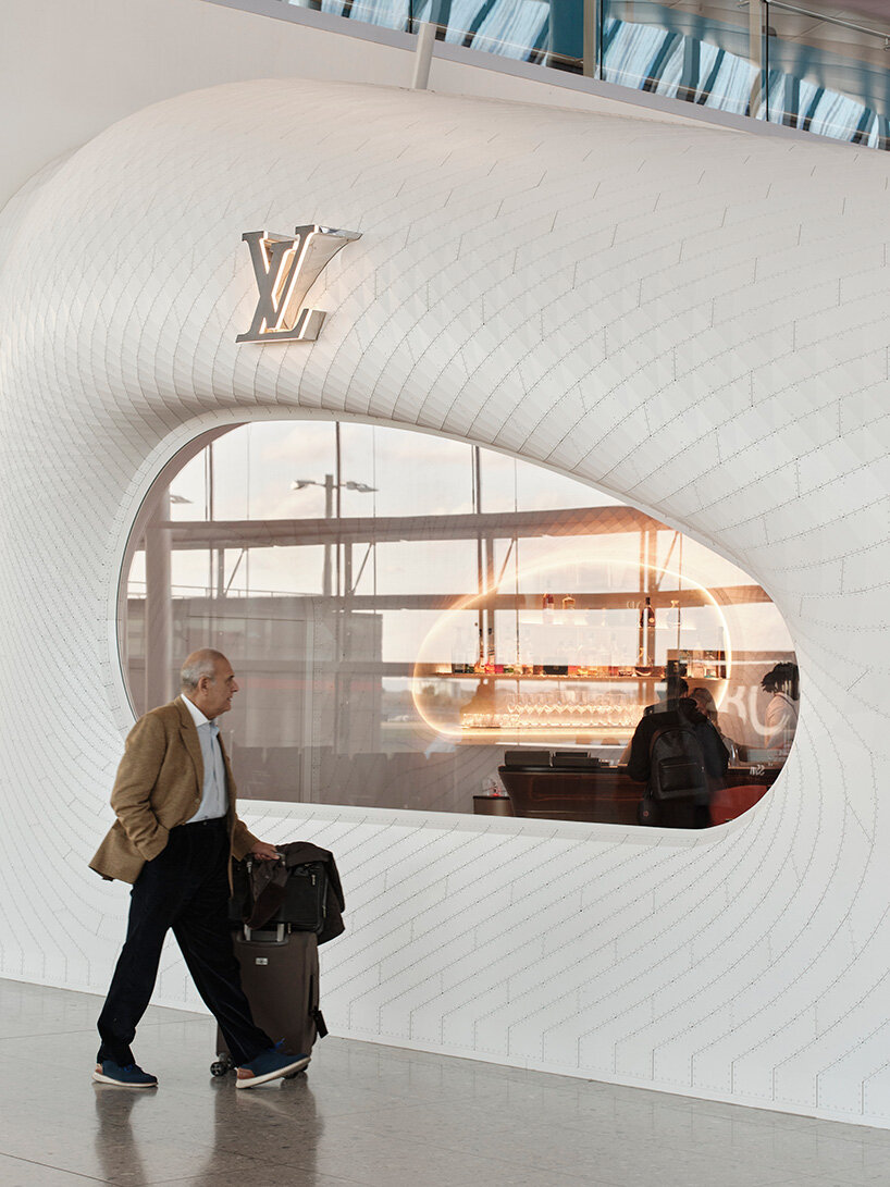 marc fornes / THEVERYMANY lands fuselage-like louis vuitton caf&eacute; and store at heathrow