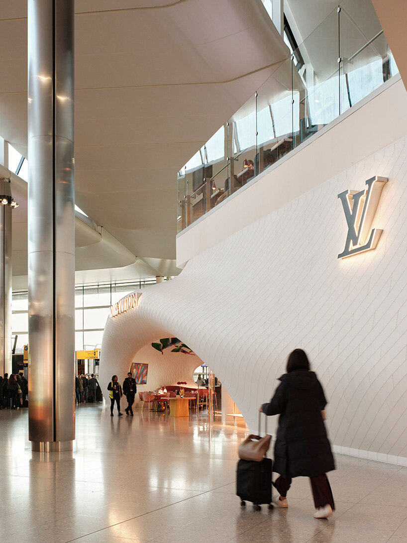 marc fornes / THEVERYMANY lands fuselage-like louis vuitton caf&eacute; and store at heathrow