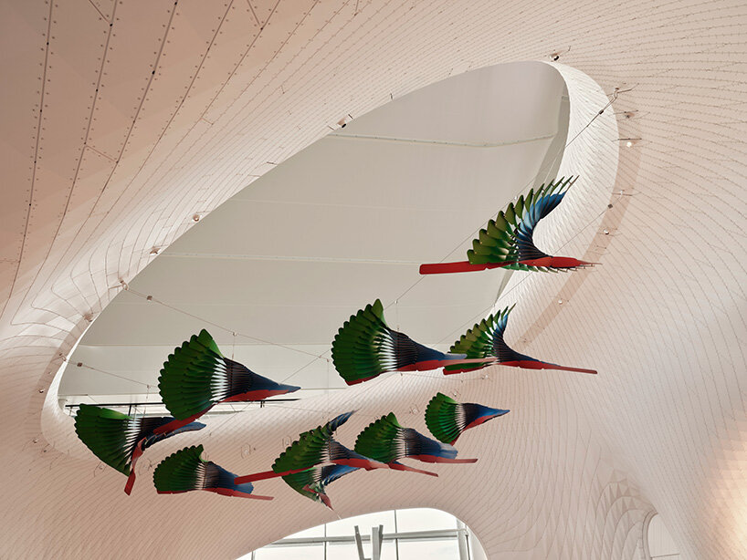 marc fornes / THEVERYMANY lands fuselage-like louis vuitton caf&eacute; and store at heathrow