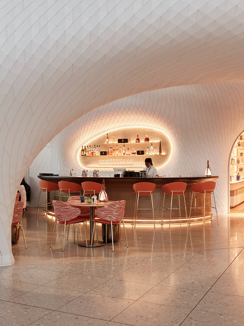 marc fornes / THEVERYMANY lands fuselage-like louis vuitton caf&eacute; and store at heathrow