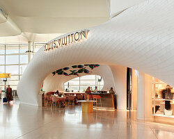 marc fornes / THEVERYMANY lands fuselage-like louis vuitton café and store at heathrow
