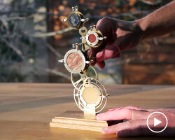 mechanical clock with rotating discs can tell what time it is on other planets