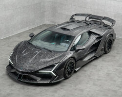 modified car made of baked carbon fiber drives with triangular tailpipes and ‘scoop’ on roof