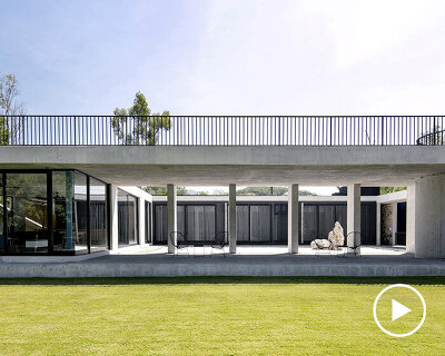 monolithic concrete residence by S-AR opens inward to patios in mexico's villa de santiago