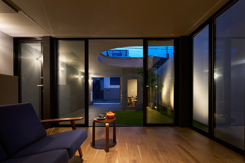 naf architect & design peels back the perimeter of tokyo house to reveal curved inner facade