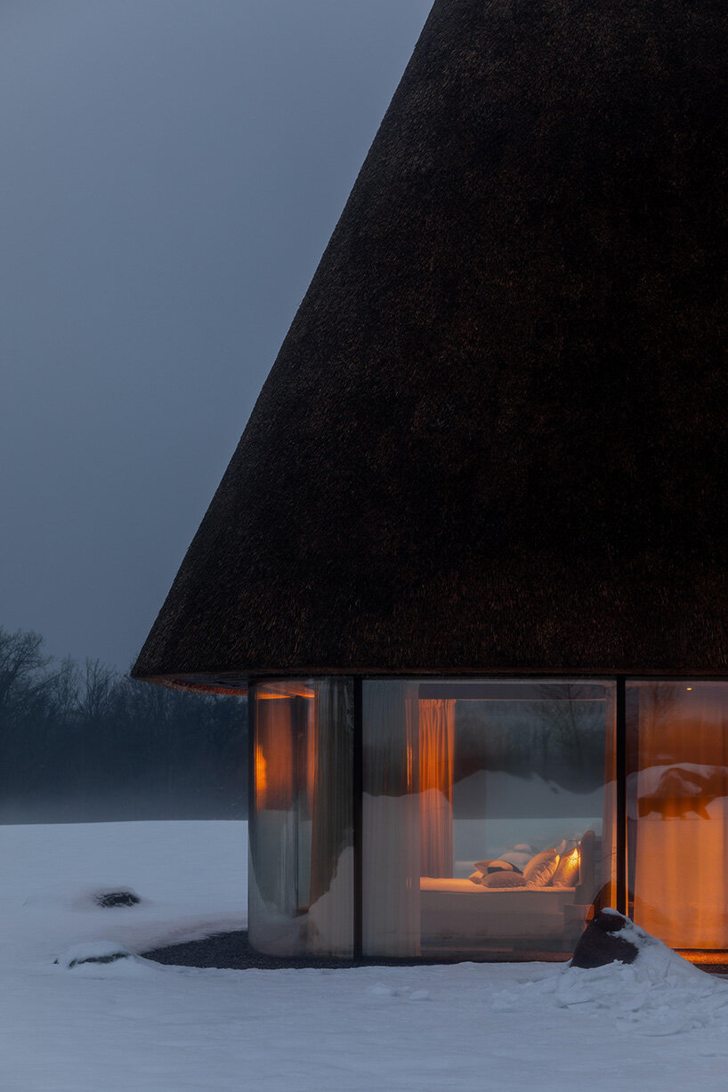 oversized reed roofs reinterpret the ukrainian mazanka in YOD group's guesthouses