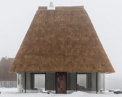 oversized reed roofs reinterpret the ukrainian mazanka in YOD group's guesthouses