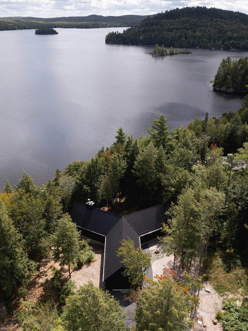 paul bernier architecte fragments residence on quebec's lake brompton into three wings