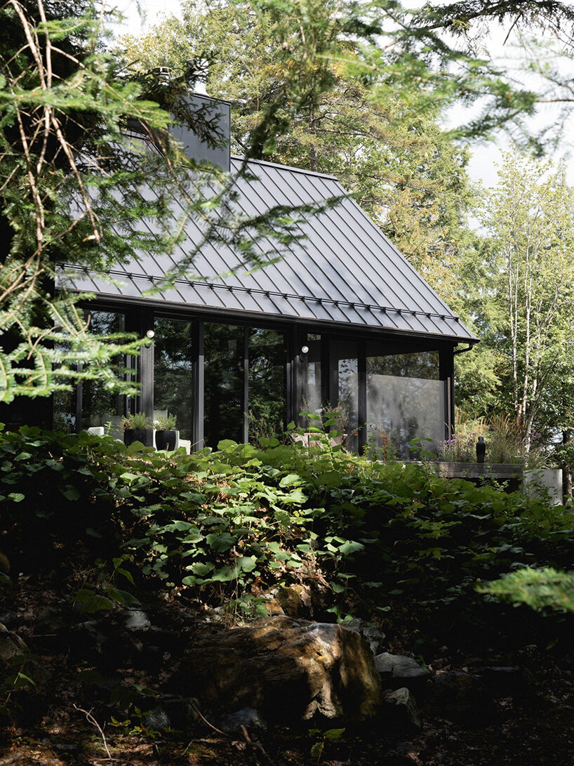 paul bernier architecte fragments residence on quebec's lake brompton into three wings