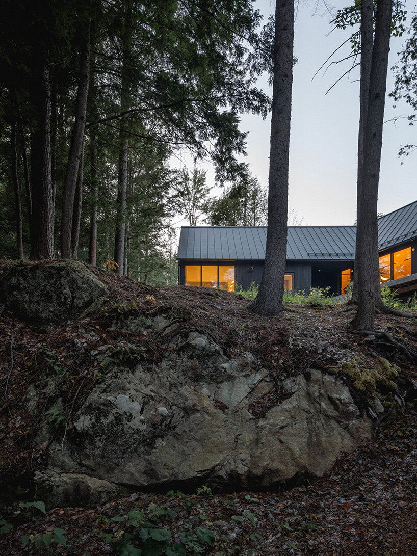 paul bernier architecte fragments residence on quebec's lake brompton into three wings