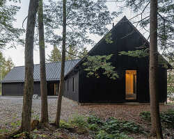 paul bernier architecte fragments residence on quebec's lake brompton into three wings