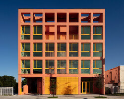 gridded peach residential facade rethinks affordable housing in miami