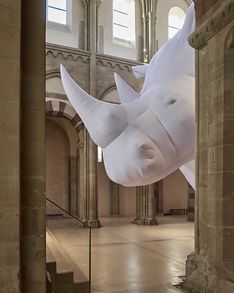 an inflatable rhinoceros occupies the medieval gallery of kunstmuseum magdeburg