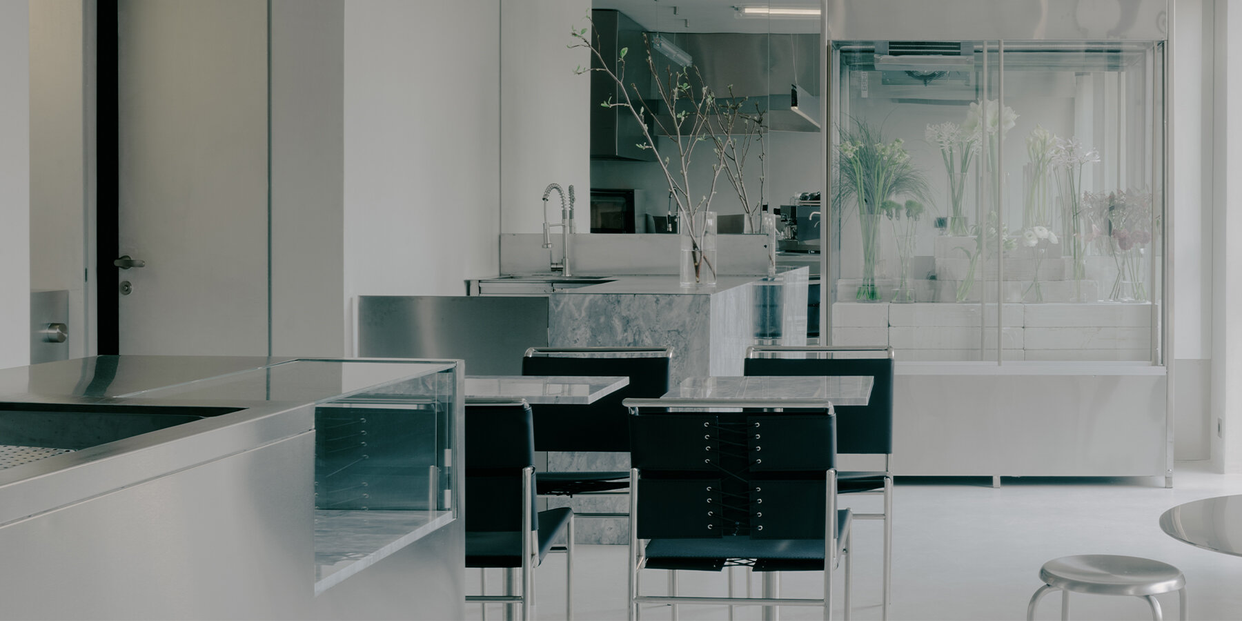 stainless-steel-concrete-futuristic-backdrop-delicate-flower-shop-cafe-tbilisi