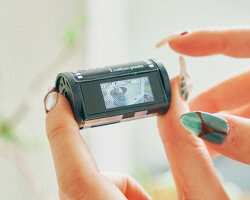 vintage film roll flips into miniature and functional digital camera