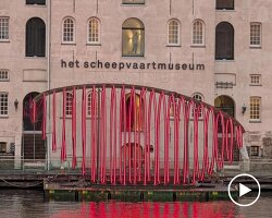 whale skeletal light installation glows red for amsterdam light festival