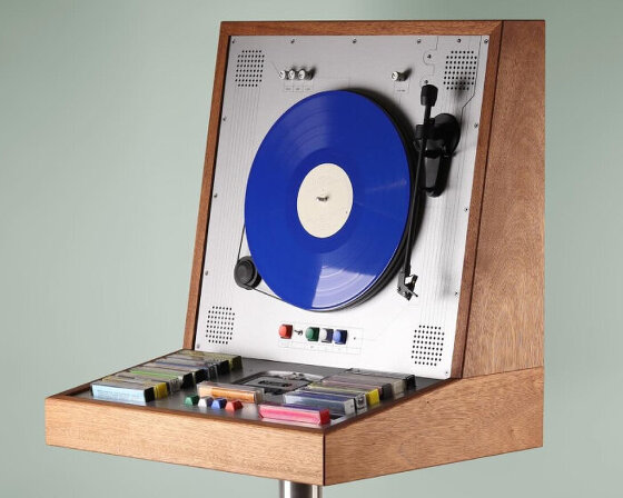 wooden music cabinet by love hultén plays vertical vinyl and casette tapes in one device