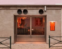 xxxi.studio divides lisbon restaurant with 15 meter long charred wood counter