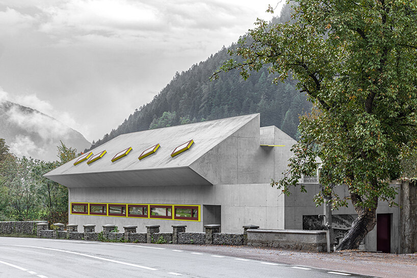yellow diamond windows pierce angular concrete staff house by bergmeisterwolf in italy