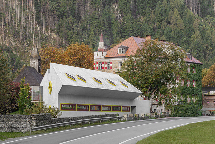 yellow diamond windows pierce angular concrete staff house by bergmeisterwolf in italy