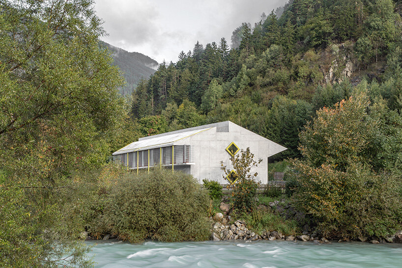 yellow diamond windows pierce angular concrete staff house by bergmeisterwolf in italy