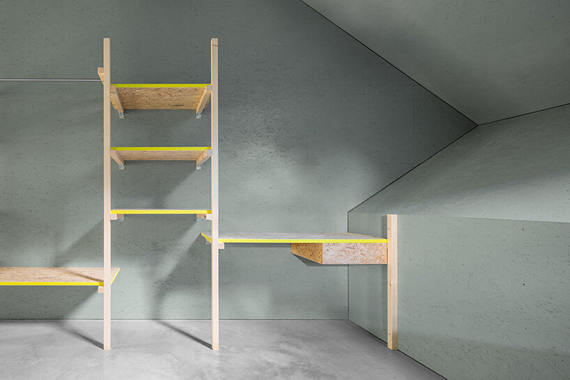 yellow diamond windows pierce angular concrete staff house by bergmeisterwolf in italy