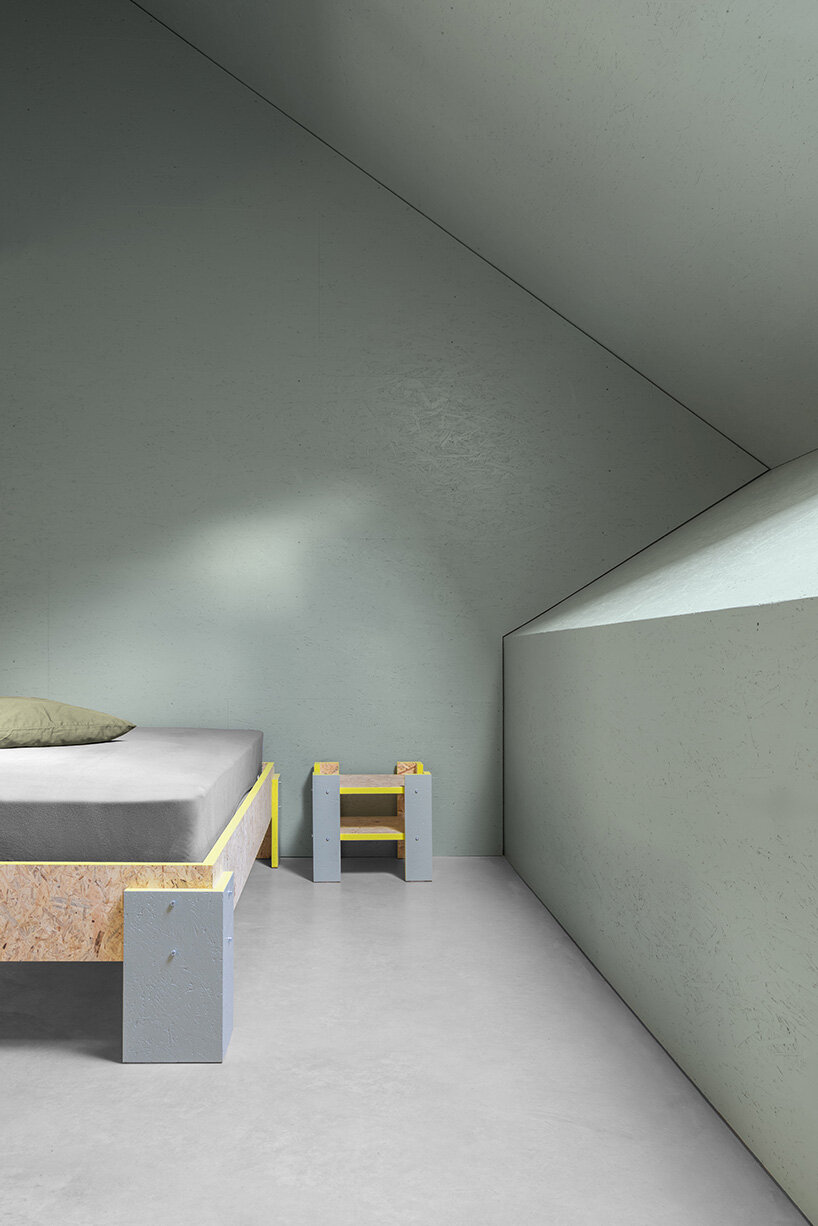 yellow diamond windows pierce angular concrete staff house by bergmeisterwolf in italy