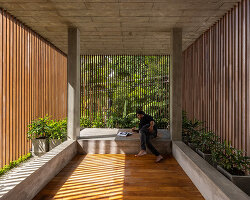 zero studio wraps its garden-filled curtain house with skin of metal screening in india