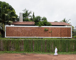 zero studio's haven house features tropical gardens enclosed by breezy brickwork