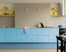 a blue 'swim lane' kitchen runs through this paris apartment renovation by acte deux