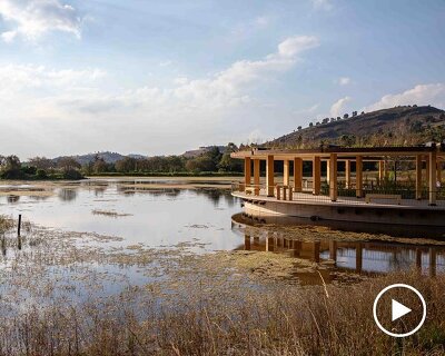 circular timber pavilion anchors wildlife and wetland restoration park in mexico