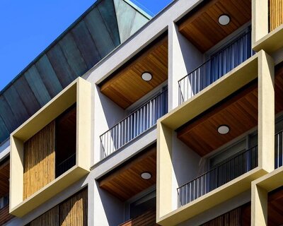 perkins&will pairs bamboo with green-toned corten steel for living block’s facade in brazil