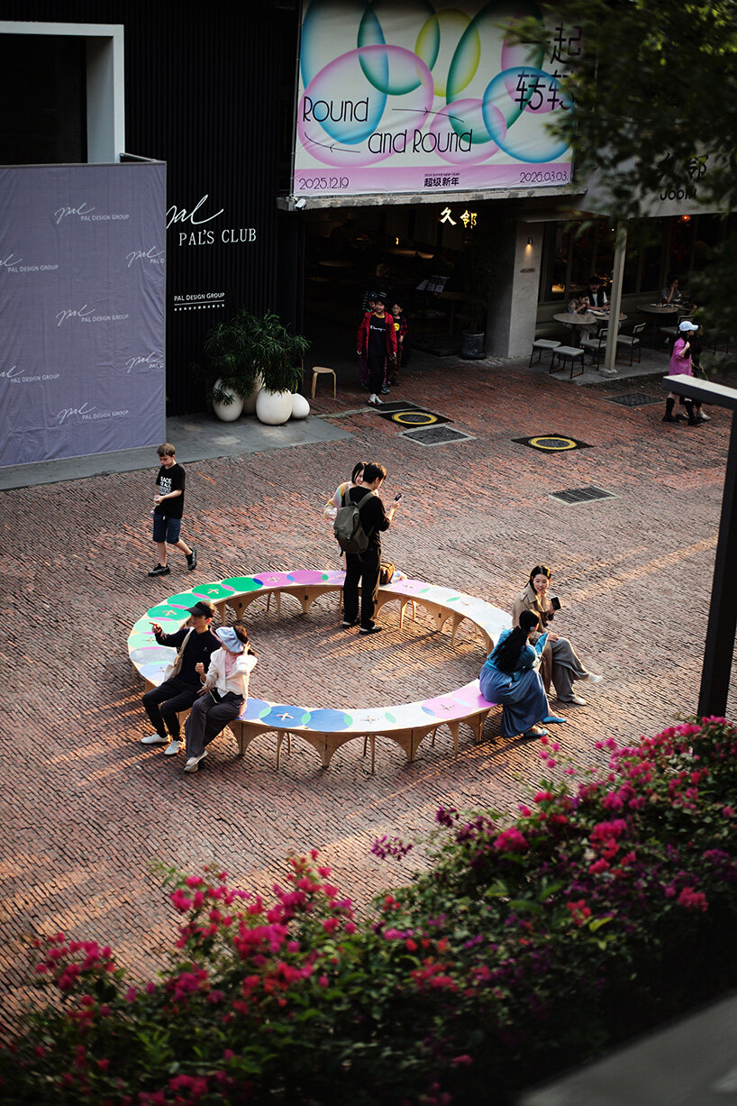 cake-like layers stack into a shared motion installation in china, bringing strangers into sync - 7