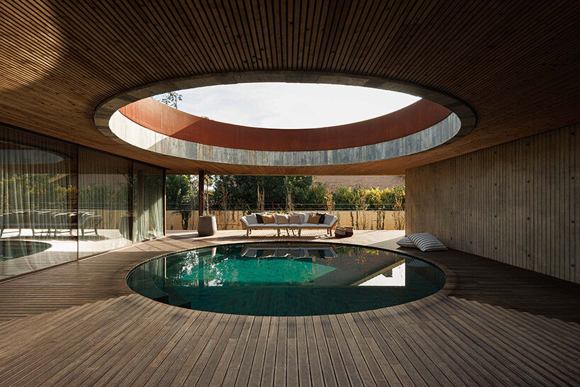 circular courtyard pool opens house by pedro henrique to sky and light in portugal - 6