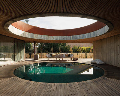 circular courtyard pool opens house by pedro henrique to sky and light in portugal