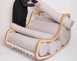 a series of movable cylindrical cushions reposition to form modular column chair