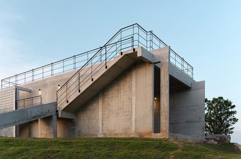 Fin Base Sign Structures repetitive vertical fins enfold concrete structure in thailand