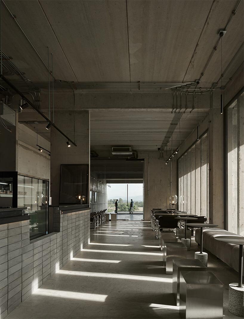 repetitive vertical fins enfold concrete structure embedded within thailand&rsquo;s mountainscape - 12