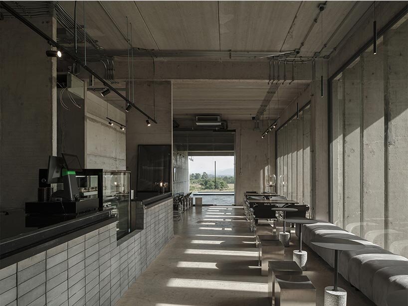 repetitive vertical fins enfold concrete structure embedded within thailand&rsquo;s mountainscape - 8