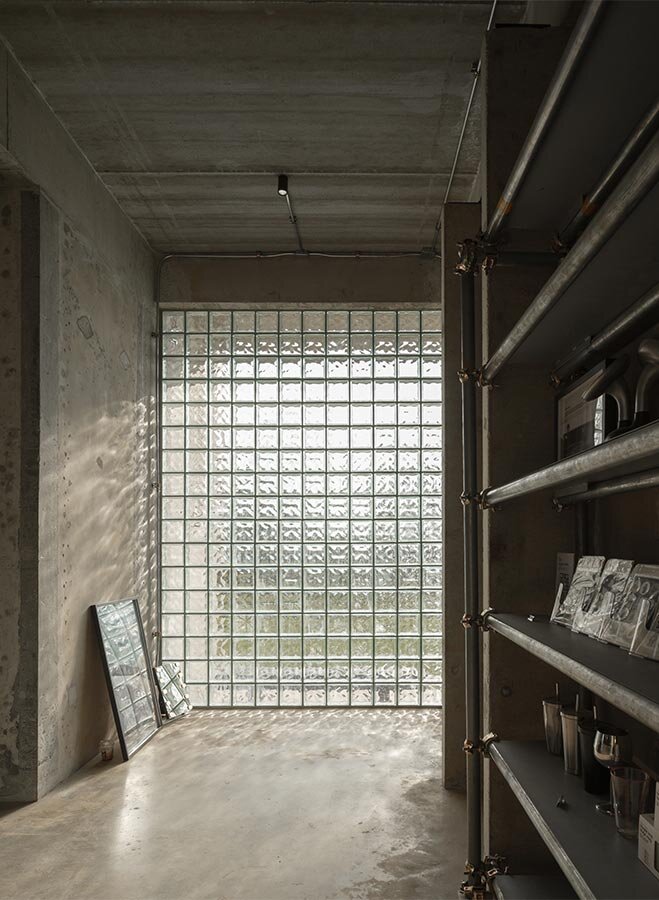 repetitive vertical fins enfold concrete structure embedded within thailand&rsquo;s mountainscape - 11