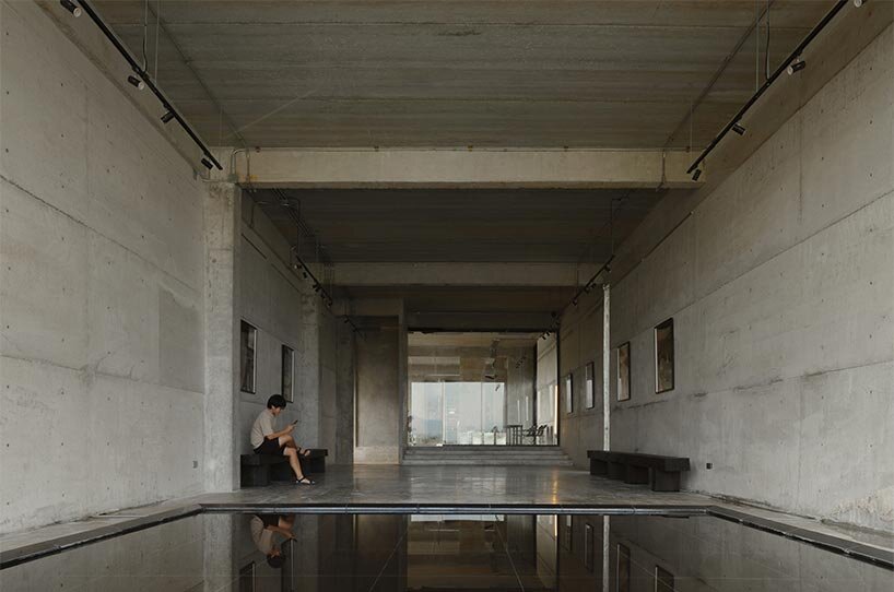 repetitive vertical fins enfold concrete structure embedded within thailand&rsquo;s mountainscape - 7