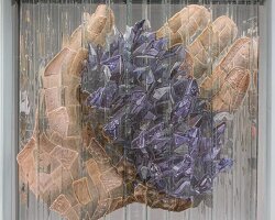 anamorphic installation by thomas medicus rotates into four shifting hand images