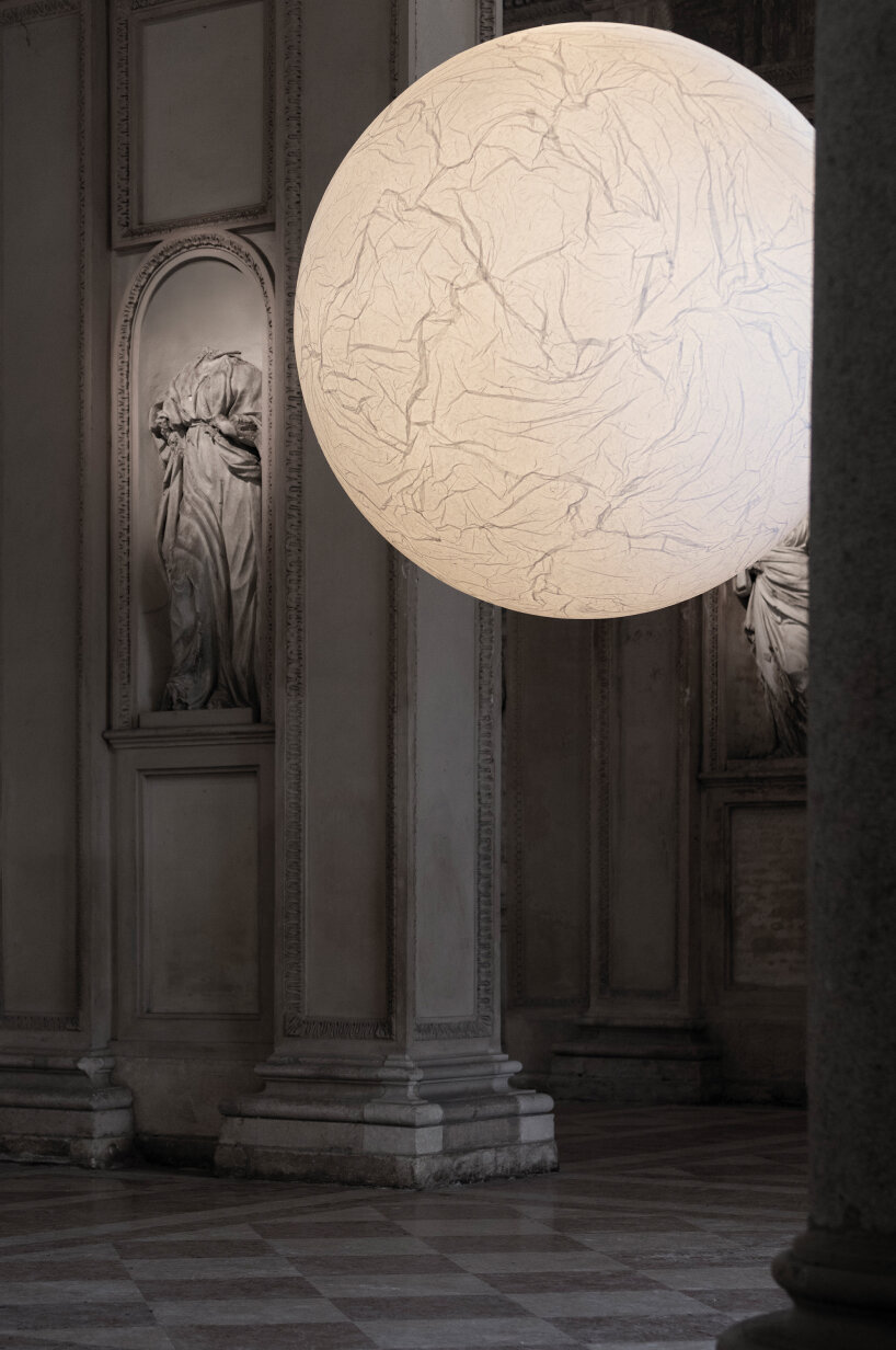 a lamp called MOON marks the threshold between the street and the interior