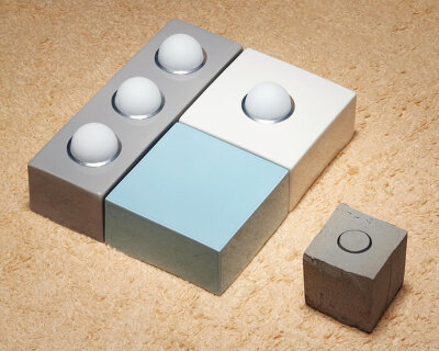 egg-shaped bulbs hatch from ceramic tiles in a modular lighting system