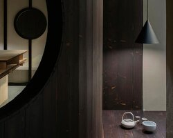 perforated wooden screens filter light and shadow within milan ceramic workshop