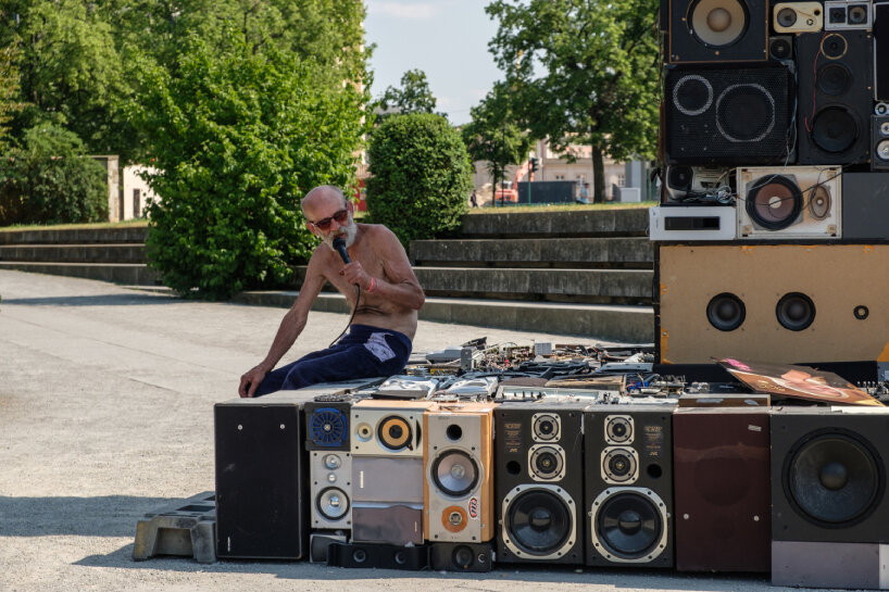viewer using the microphone at the Obelisk installation in Potsdam, Germany