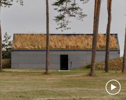 grass-covered seaside family home repurposes abandoned soviet military bunkers in latvia