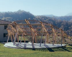 GRRIZ shapes reversible timber structure along the arc of the setting sun in italian mountains
